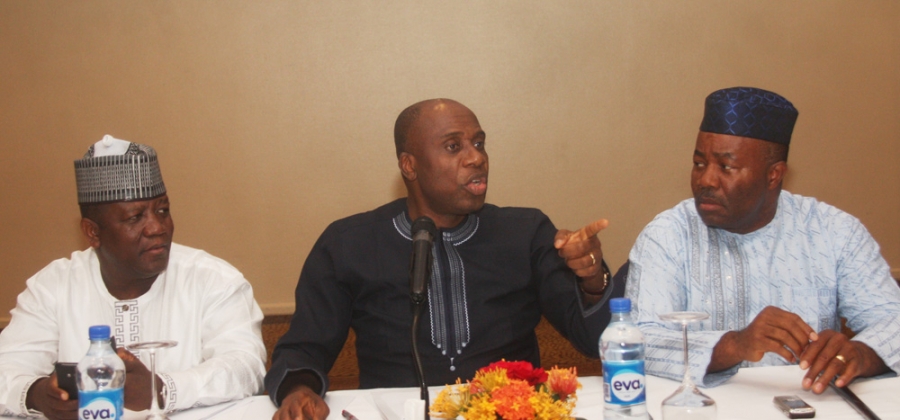 Chairman, Nigeria Governors’ Forum (NGF) and Rivers State Governor, Rotimi Amaechi, addressing the media during the NGF reconciliation meeting and emergence of Zamfara State Governor, Alhaji Abdul-Azeez Yari, as his successor in Abuja. With him are Governor Godswill Akpabio of Akwa Ibom State (right) and Yari.