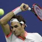 Roger Federer, of Switzerland, returns a shot to Novak Djokovic, of Serbia, during the men's championship match of the U.S. Open tennis tournament, Sunday, Sept. 13, 2015, in New York. (AP Photo/Bill Kostroun) ORG XMIT: USO342