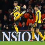 BOURNEMOUTH, ENGLAND - JANUARY 03: Olivier Giroud (1st L) of Arsenal celebrates scoring his team's third goal during the Premier League match between AFC Bournemouth and Arsenal at Vitality Stadium on January 3, 2017 in Bournemouth, England.  (Photo by Warren Little/Getty Images)
