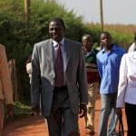 FILE PHOTO - Kenya's Deputy President William Ruto and his wife Rachael are escorted as they walk to their home in Sugoi village near Eldoret, Kenya, in this photo taken August 4, 2010. Picture taken August 4, 2010. REUTERS/Thomas Mukoya