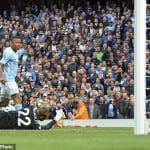 Manchester City's Gabriel Jesus, left, scores his side's 3rd goal during the English Premier League soccer match between Manchester City and Liverpool at the Etihad Stadium in Manchester, England, Saturday, Sept. 9, 2017. (AP Photo/Rui Vieira)