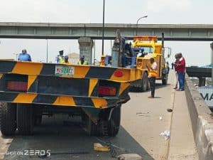Container-laden truck falls in Lagos, damages car, motorcycle