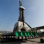 Oil nudges up on trade optimism but Saudi supply weighs