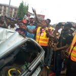 Two escape death in Onitsha as containers fall on vehicle