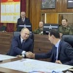 Putin visits Damascus, meets Assad