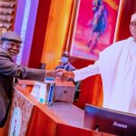 Buhari swears in Justice Ariwoola as Ag. CJN