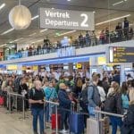 Passengers wait in line at the Schiphol Airport, on April 30, 2022.  The airport is facing serious staff shortages due to hundreds of vacancies at the check-in desks, security and in the baggage handling area that cannot be filled. - Netherlands OUT
(Photo by Evert Elzinga / ANP / AFP)