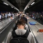 FILE PHOTO: Workers travel through London Bridge rail and underground station during the morning rush hour in London, Britain, September 8, 2021. REUTERS/Toby Melville