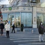 A member of the Chinese People's Armed Police Force wears a face mask as he keeps watch on a street amid coronavirus disease (COVID-19) outbreaks in Beijing, December 1, 2022. REUTERS/Thomas Peter
