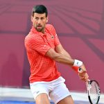 Serbia's Novak Djokovic plays a backhand return to France's Luca van Assche during their tennis singles match at the Sprska Tennis Open ATP 250 series tournament in Banja Luka, on April 19, 2023. (Photo by ELVIS BARUKCIC / AFP)