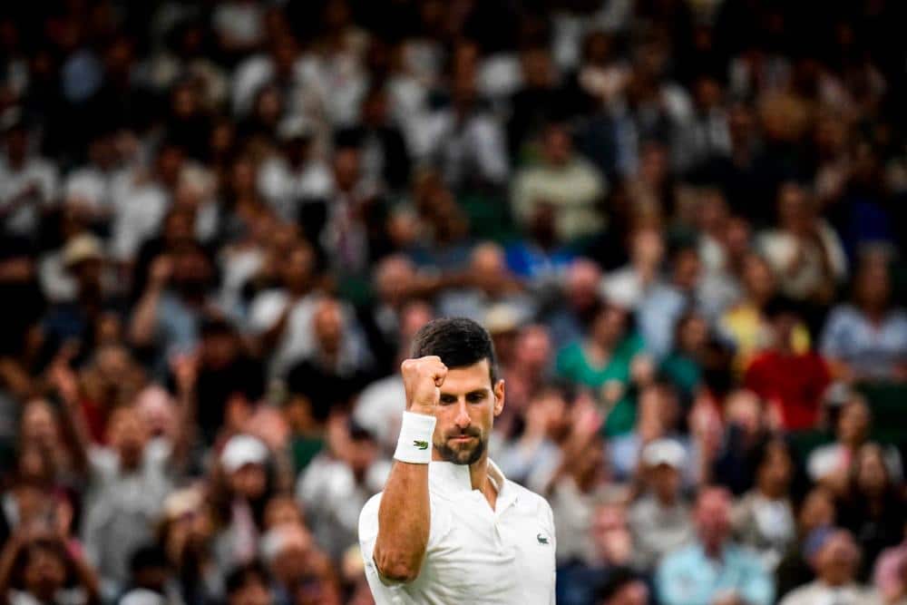 Djokovic’s march to victory halted by Wimbledon curfew