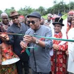 Commissioner for Chieftaincy & Community Affairs in Rivers State, Engr. Charles Amadi, flanked by NLNG’s GM for External Relations & Sustainable Development Andy Odeh, commissioning the 1km Rumuji/Rumuewhor Link Road, initiated and completed by the Rumuji community and funded by the Nigeria LNG Limited’s Global Memoranda of Understanding (GMoU) scheme on Tuesday…in Rumuji.
