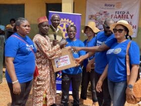Rotary club gifts Abuja community residents food, Medicare