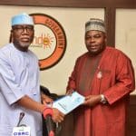 Aiyedatiwa receiving the budget from the Speaker, Olamide Oladiji
