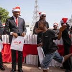 L-R: Group Deputy Managing Director, United Bank for Africa(UBA), Muyiwa Akinyemi; GMD/CEO, Oliver Alawuba; and Managing Director/CEO, UBA Foundation, Bola Atta with some beneficiaries of UBA Foundation Annual Food Bank initiative, where the Foundation served foods to the less privileged and individuals in need, around the bank’s headquarter in Marina, Lagos...on Thursday.