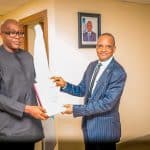 Outgoing Director General, Nigerian Maritime Administration and Safety Agency, NIMASA, Dr Bashir Jamoh, OFR (right) in a warm handshake with Executive Director, Finance and Administration/Acting Director General, Hon. Chudi Offodile during the Hand Over Ceremony held at the NIMASA Towers in Victoria Island, Lagos.