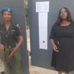 Officials of the Competition and Consumer Protection Tribunal (CCPT) after pasting the interim order at the office of the Multi-Choice Nigeria Limited, Wuse II, Abuja.