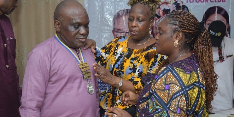 Rotarian Muyiwa Akintunde being decorated by his two immediate predecessors, Rotarian Olayinka Patunola-Ajayi (second right) and Rotarian Adebukunola Soile-Balogun