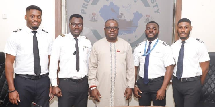 The Administrator of the Presidential Amnesty Programme, Dr Dennis Otuaro (centre); Cadet Pilots Lawrence Oliki and Kingsley Bassey (left); Cadet Pilots Osekporovwere Diamond and  Crosby Otobo (right) when the Administrator officially hosted the quartet at the PAP Office in Abuja on July 5, 2024, after the completion of their sponsored type-rating programme in South Africa.