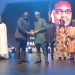 2024 Winner of The Nigeria Prize for Literature, Familoni Olubunmi (R) receives his plaque from Olakunle Osobu, Deputy MD, NLNG, at the Grand Award Night. With them are (L-R)  Prof Ahmed Yerima (Board member), Dr Philip Mshelbila, NLNG MD, Prof Akachi Adimora-Ezeigbo (Chairman) and Prof Olu Obafemi, (Board member) of the Literature Prize Advisory Board