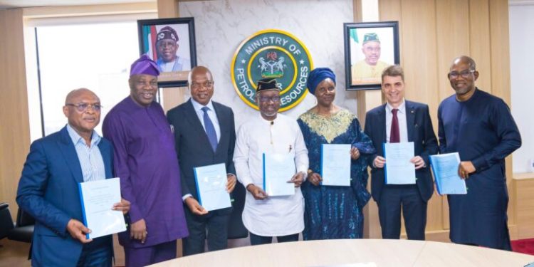 Minister of Petroleum Resources (Gas), Mr Ekperikpe Ekpo (middle) with Partners at the SPDC JV/Brass Fertiliser and Petrochemical Company Limited Gas Sales and Purchase Agreement signing on Friday...in Abuja