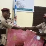 FRSC Lagos Sector Commander, Kehinde Hamzat (left) presenting a gift to Habib Sayidi