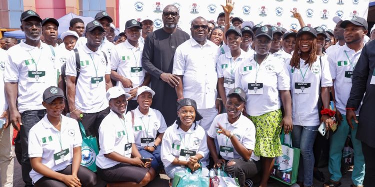 Special Assistant to the National Security Adviser on Niger Delta, Mr Goodluck Ebelo (middle left), and the Administrator of the Presidential Amnesty Programme, Dr Dennis Otuaro (middle right), in a group photograph with PAP scholarship students during the orientation programme for 1,700 scholarship beneficiaries deployed for the 202/2025 academic session in Warri, Delta State...on Friday.