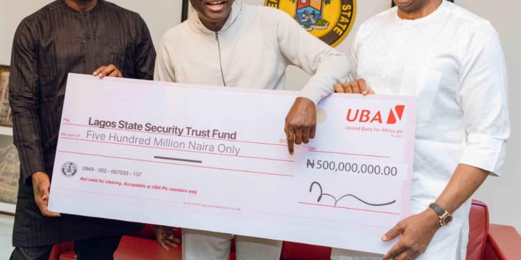 L-R: Group Deputy Managing Director, United Bank for Africa (UBA), Muyiwa Akinyemi; Lagos State Governor, Babajide Sanwo-Olu; and Group Chairman, UBA, Mr. Tony Elumelu, during the presentation of N500m to Lagos State Security Fund by UBA Foundation, the corporate social responsibility arm of UBA, held at Lagos House, Marina...on Sunday.