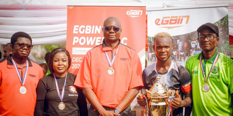 L-R: Head, QHSE, Julius Akpong; CSR, Brand & Event Specialist, Stella Olugbemi; Head, Maintenance, Felix Ebiware (all of Egbin Power), Captain of Alagura FC, Muyideen Oduga; and Nigeria’s ex-international player/Atlanta ’96 Olympic Gold Medallist, Abiodun Obafemi during the presentation of 1st position Trophy to Alagura FC at the 2024 Egbin Power Community Football Competition, held in Ipakan Community Stadium, Ikorodu, Lagos.