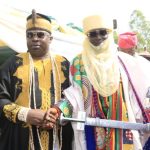 Aholu of Kweme kingdom, Oba Sejiro James, presenting staff of office to Mohammed Umar
