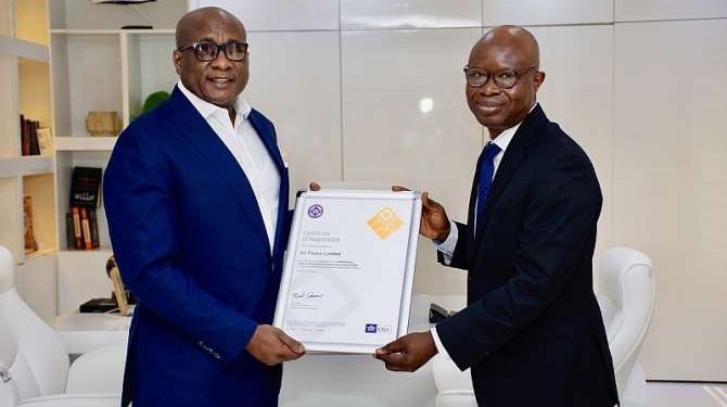 Alt="L-R: Chairman/CEO Air Peace Ltd., Dr Allen Onyema, receiving International Air Transport Association Operational Safety Audit (IOSA) Certification from the Area Manager, West and Central Africa, IATA, Dr Samson Fatokun, at the Air Peace Corporate Head Office, Lagos"