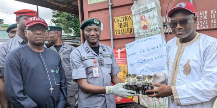 Alt="The Deputy Commander of Narcotic, Area Commander Festac, National Drug Law Enforcement Agency (NDLEA), Mr Abdul Maiyaki, the Comptroller of Customs, Federal Operation Unit FOU Zone ‘A’ Muhammed Shuaibu while handing over illicit drugs and cannabis sativa to NDLEA and NAFDAC, respectively, in Lagos on Friday"