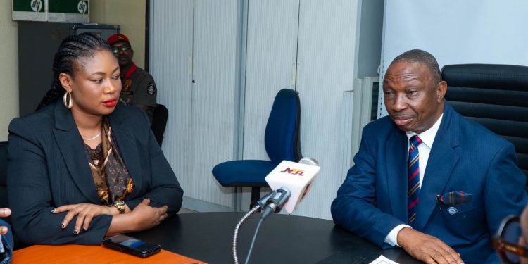Ag. Permanent Secretary, Federal Ministry of Budget and Economic Planning, Dr. Damson Ebimaro (right) with Ambassador Abigail Amalaga, Country President, United Towns Agency, during the handing over of the MoU they signed, in Abuja.