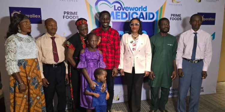 The Assistant Director Loveworld Medicaid,  Dr Jumoke Ola-Akisanya with the beneficiaries of the V.I.S.I.O.N.10,000 FREE EYE SURGERIES