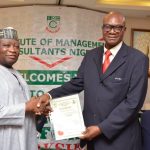 Ladi Ayodeji (right) receiving an award from the Institute of Management Consultants.