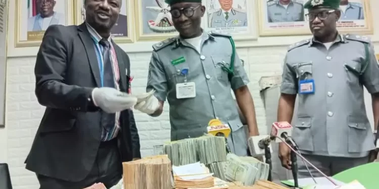 Alt="From left, Assistant Commander of EFCC, Richard Adejumo, Customs Area Controller of the command, Comptroller Chidi Nwokorie, and DC NI Maduemezie, Deputy Comptroller in charge of Administration, during the handover at Muritala Muhammed International Airport in Lagos on Tuesday"