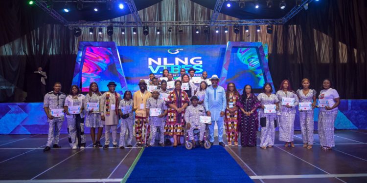 Alt=" Sophia Horsfall (middle), GM, External Relations & Sustainable Development, Yemi Adeyemi (6th left), Manager, Community Relations & Sustainable Development, with beneficiaries at the NLNG VIBES Graduation/Induction Ceremony in Port Harcourt today"