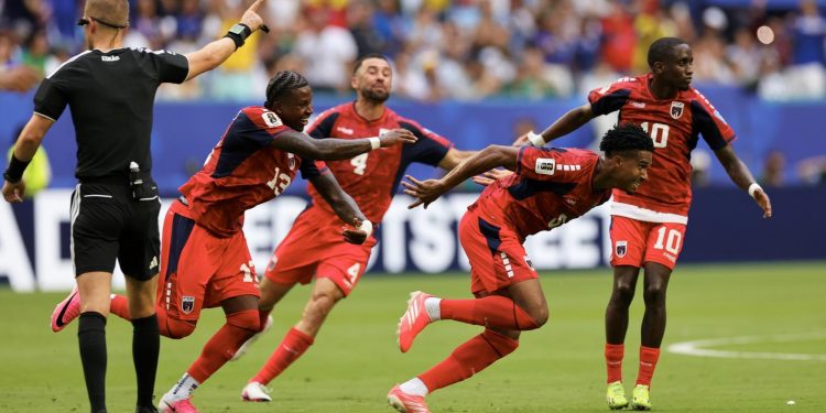 21 June 2026; Kevin Pina of Cabo Verde celebrates after scoring her side's first goal with team-mates, including Roberto Lopes, 4, during the 2026 FIFA World Cup Group H match between Uruguay and Cabo Verde at Miami Stadium in Miami, Florida, USA. Photo by Michael Pimentel/Sportsfile