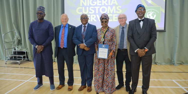 From left: Abdullahi Aliyu Maiwada, PhD,
National PRO, Nigeria Customs Service; Mr. Timi Bomodi, Deputy Comptroller-General of Customs (DCG); Roger Wolens, President, Green Apple Awards; Mbiduffu Ibrahim fsi, Comptroller in Charge of CSR; Prof. John Struthers, University of West Scotland and Mr. Chris Adetayo, Consultant CSR at the Commonwealth CSR Awards held at the Bargeddie International Hub, Bargeddie, Scotland, United Kingdom on Friday 31, July 2026.