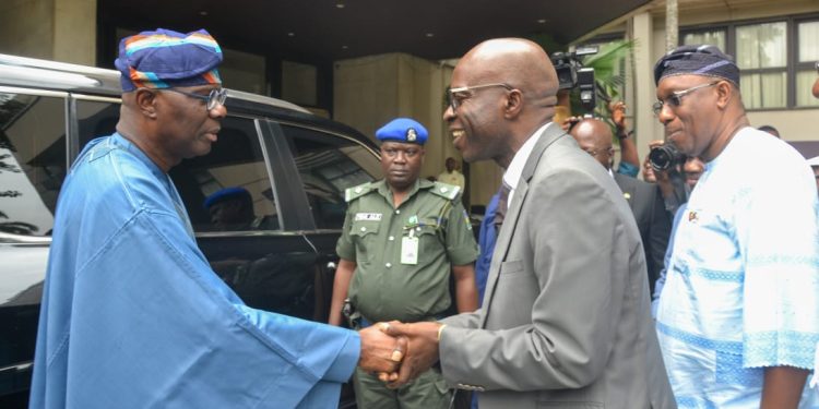 Akinadewo (right) receiving Sanwo-Olu